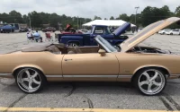 A bronze colored classic car